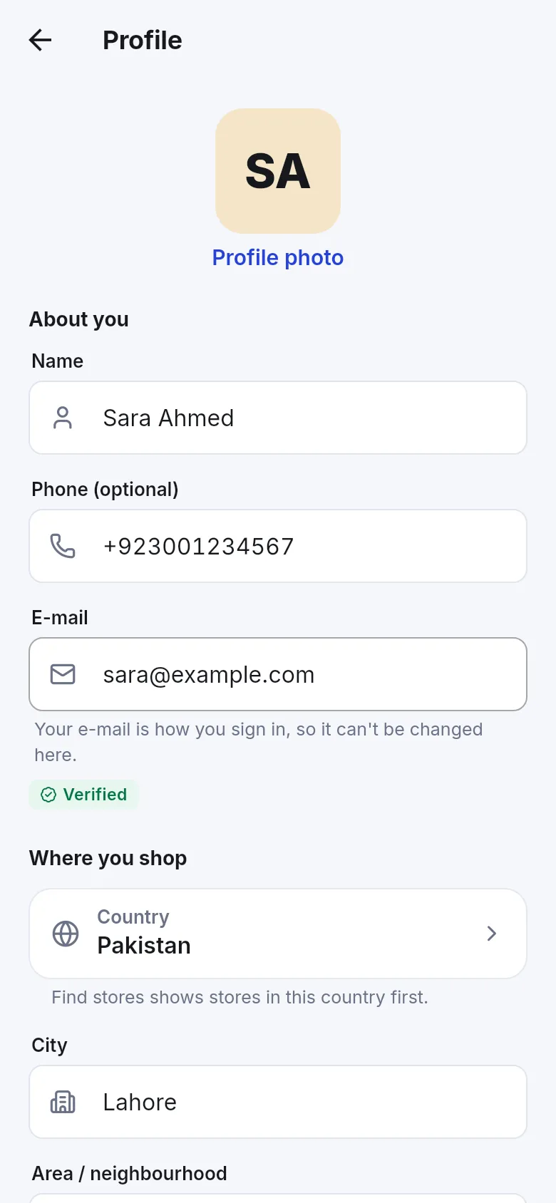 Profile screen with Profile photo, Name, Phone (optional), E-mail with a Verified badge, and Where you shop with Country Pakistan and City Lahore